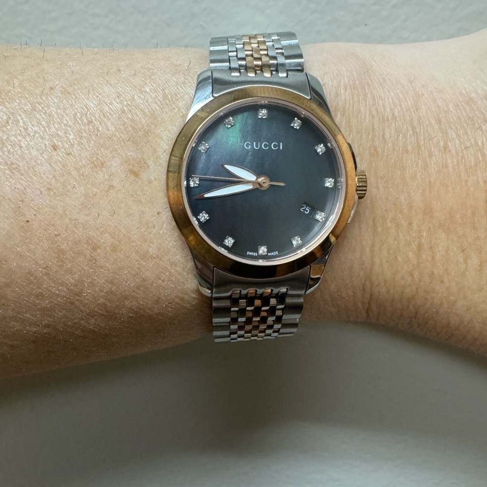 Gucci Women’s Black and Gold-Tone Watch with diamond dial
